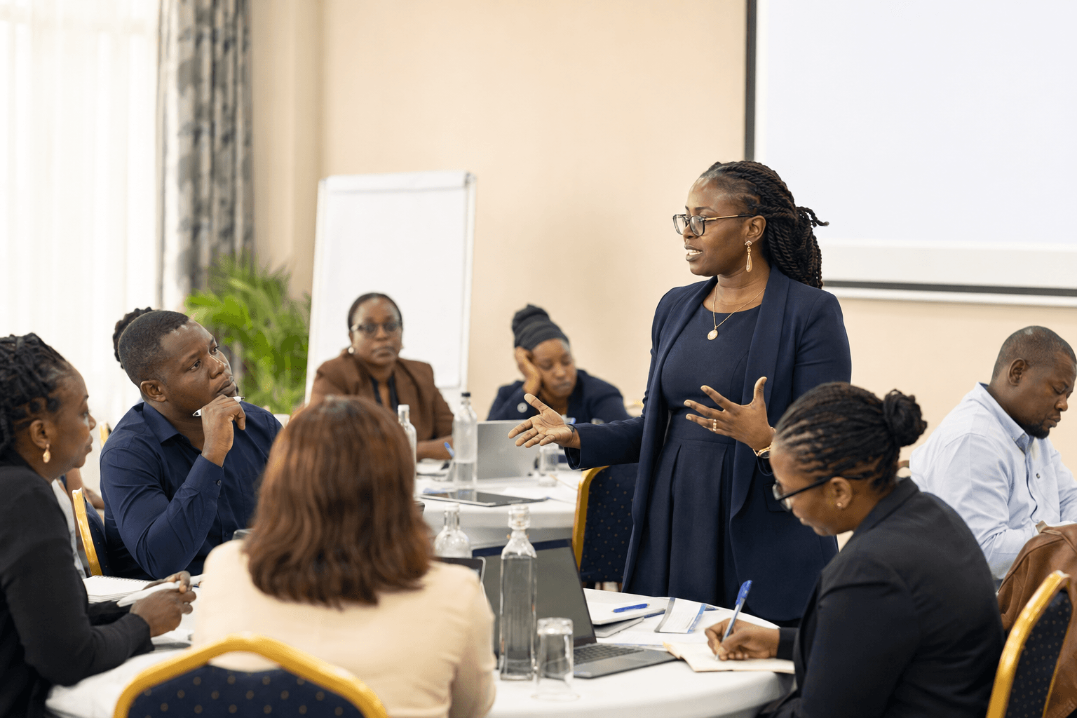 Facilitator leading a finance and donor-compliance workshop for NGO professionals.